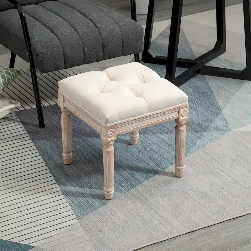 Pouffe carré capitonné en lin avec pieds sculptés en hévéa de 40 cm